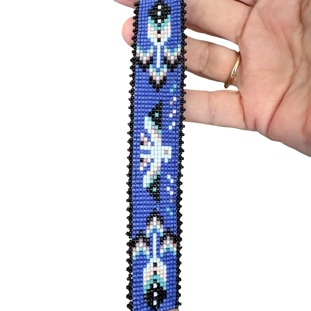 Hand crafted Adjustable Beaded Bracelet with Thunderbird and charms